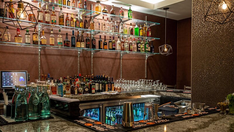 Bar with a various types of liquor bottles